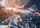 Hands of car mechanic  working in auto repair service.