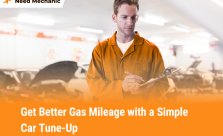 Auto mechanic writing notes during car tune-up to improve fuel efficiency and gas mileage at Need Mechanic shop