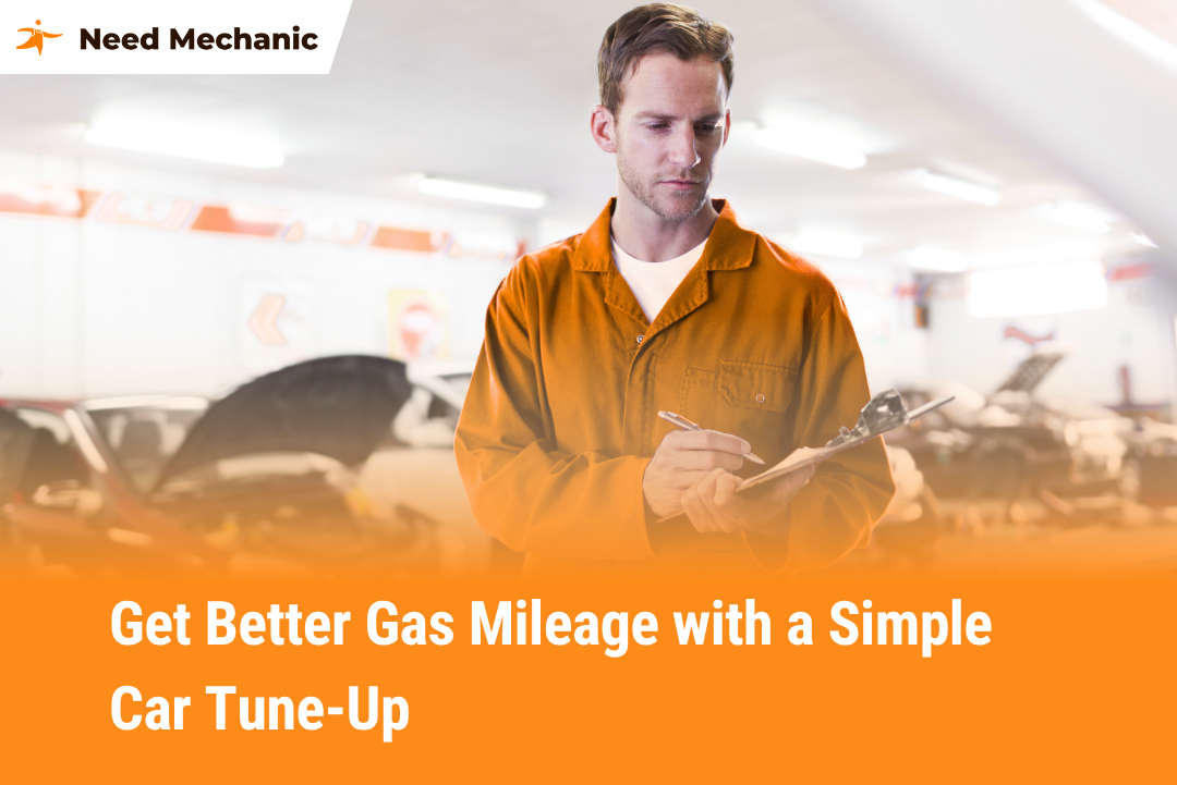 Auto mechanic writing notes during car tune-up to improve fuel efficiency and gas mileage at Need Mechanic shop