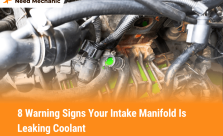 Engine showing coolant leak symptoms from a damaged intake manifold with green coolant and labeled warning signs