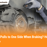 Mechanic inspecting brake caliper and rotor to fix car that pulls to one side when braking