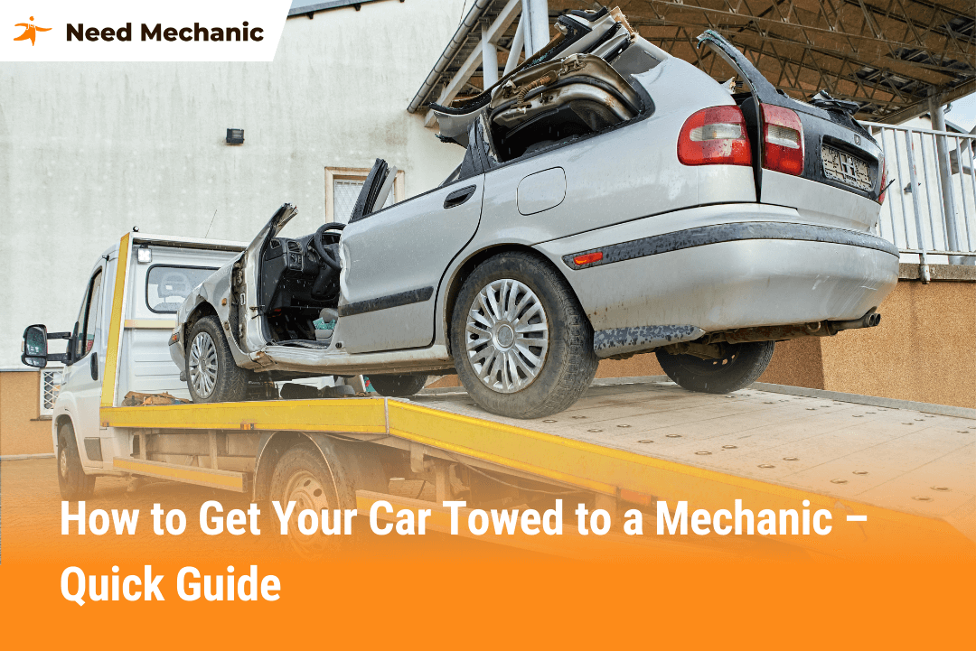 Tow truck loading a damaged car onto a flatbed, showing how to get your car towed to a mechanic safely and quickly.