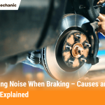 Mechanic repairing car brake rotor and pads to fix grinding noise when braking