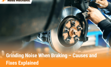Mechanic repairing car brake rotor and pads to fix grinding noise when braking