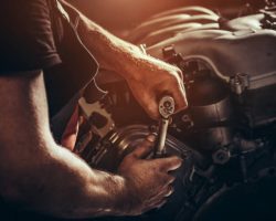 Repairing V10 engine in auto repair shop