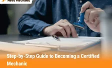 Person stamping certification papers for becoming a certified mechanic