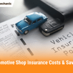 Miniature blue car and car key placed on a vehicle insurance policy document, symbolizing automotive shop insurance costs and savings.