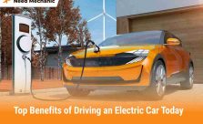 Orange electric car charging at home station highlighting benefits of EV ownership.